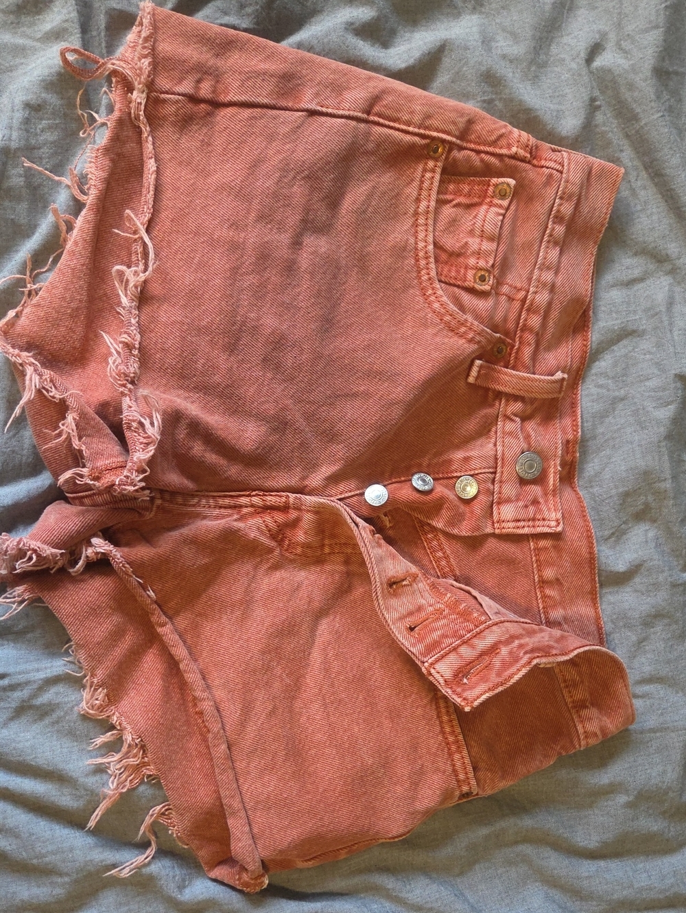 Levi's High-Rise Frayed Denim Shorts in Rust